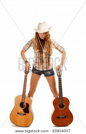 Sesy cowgirl in cowboy hat with acoustic guitar