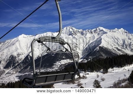 Chair-lift At Ski Resort And Snow Winter Mountains In Nice Sun Day