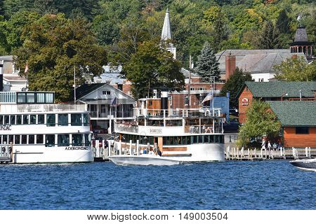 LAKE GEORGE, NY - SEP 24: Cruises around Lake George in New York State, as seen on Sep 24, 2016. The lake lies within the upper region of the Great Appalachian Valley and drains all the way northward into Lake Champlain and the St. Lawrence River drainage
