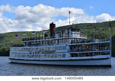LAKE GEORGE, NY - SEP 24: Cruises around Lake George in New York State, as seen on Sep 24, 2016. The lake lies within the upper region of the Great Appalachian Valley and drains all the way northward into Lake Champlain and the St. Lawrence River drainage