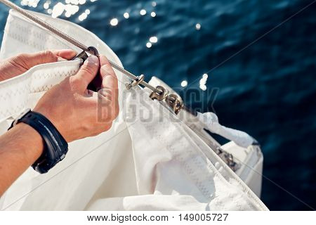 Preparing before lifting staysail sails. Before going out into the sea