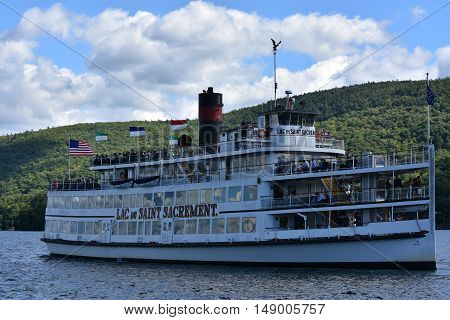 LAKE GEORGE, NY - SEP 24: Cruises around Lake George in New York State, as seen on Sep 24, 2016. The lake lies within the upper region of the Great Appalachian Valley and drains all the way northward into Lake Champlain and the St. Lawrence River drainage