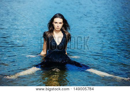 Sexy Young Girl Sits In The Water