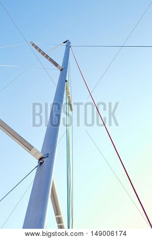 Staysail halyard on the mast, near the spreaders, snrouds and backstay