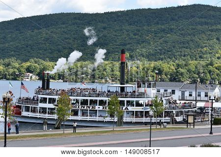 LAKE GEORGE, NY - SEP 24: Cruises around Lake George in New York State, as seen on Sep 24, 2016. The lake lies within the upper region of the Great Appalachian Valley and drains all the way northward into Lake Champlain and the St. Lawrence River drainage