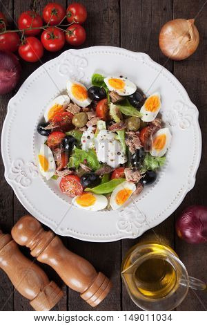 Salad Nicoise with boiled eggs, tuna, anchovy and olives