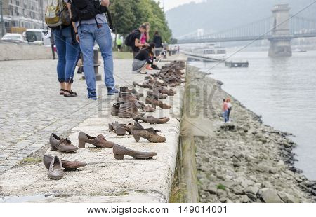 BUDAPEST, HUNGARY - SEPTEMBER 17: Shoes on the Danube Promenade - a monument to victims of the Holocaust, on September 17, 2016 in Budapest, Hungary.