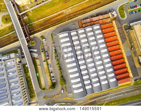Aerial view to industrial zone and technology park. European industry from above. Architectural background.