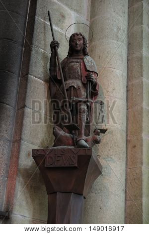 Mont Saint Michel France - September 8 2016 Benedictine Abbey of Mont Saint-Michel in Normandy Archangel Michael with scales and sword