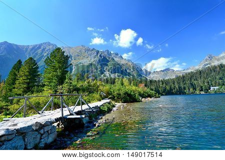 Wide angle landscape shot of glacial lake Popradske pleso in High Tatras.