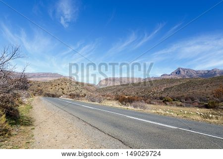 Road And Clouds Pointing To The Swartberg Pass