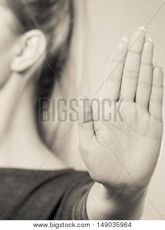 Female Shows Stop Sign By Her Hand.