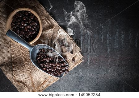 Coffee bean on black stone background.Selective focus