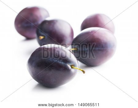 Fresh ripe plums isolated on white background.
