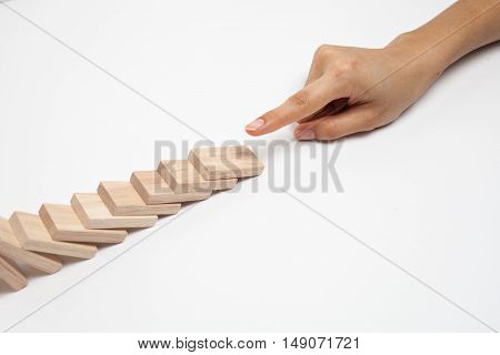 Hand and falling pieces on white background