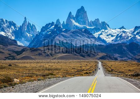  Fine concrete highway to the majestic Mount Fitz Roy. Sunny autumn day in February. Argentine Patagonia