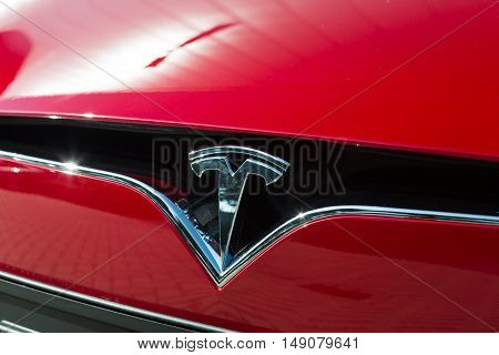 TILGURG, NETHERLANDS - SEPTEMBER 25, 2016: TESLA  MODEL-S. TTesla Model S signage of a red car in Tilburg, Netherlands.