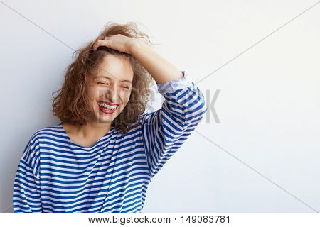 Fashion lifestyle portrait of young happy pretty woman laughing and having fun in stylish vintage outfit on white bacground with copy space