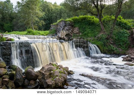 Waterfall of ruined ancient windmill on the river Viata. Belarus, Miorskiy district.