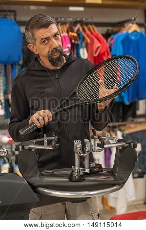 Tennis Stringer Doing Racket Stringing