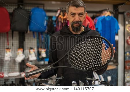 Tennis Stringer Doing Racket Stringing
