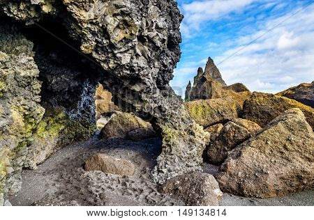 Natural basalt arch at Reynishofn beach - South Iceland