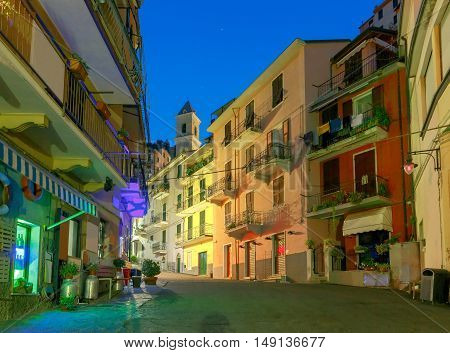 The old narrow street in the medieval Italian village of Manarola at night. Parco Nazionale delle Cinque Terre Liguria Italy.