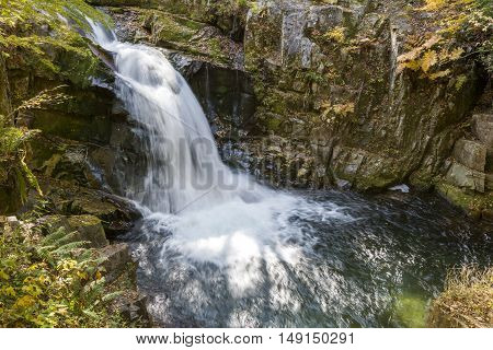 Autumn Yamabiko waterfall surrounded by rocks in Minakami, Gunmma