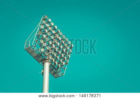Stadium light against blue sky vintage tone