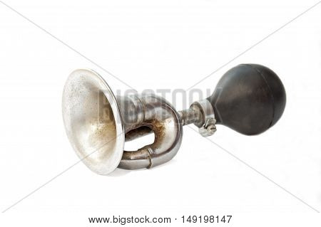 Old fashioned rusty bike horn isolated on white background