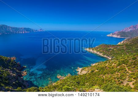 View from famous D81 coastal road with view of Golfe de Girolata from Bocca Di Palmarella Corsica France Europe.