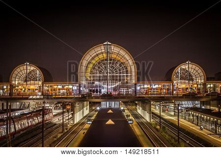 view over a train station at night time