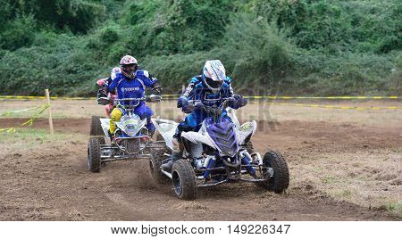 Unidentified Racer Rides A Quad Motorbike.