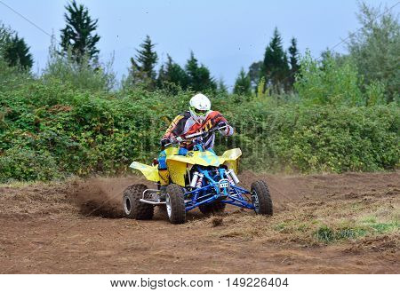 Unidentified Racer Rides A Quad Motorbike.