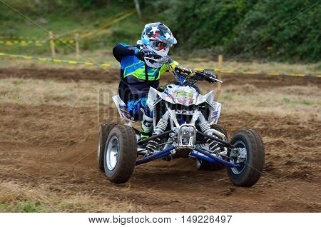 Unidentified Racer Rides A Quad Motorbike.