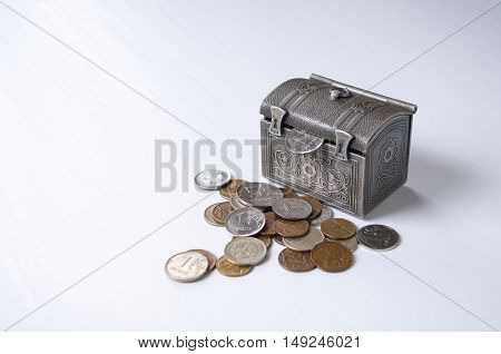 From the trunk sticking ruble next to a pile of coins
