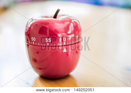 0 Minutes / 1 Hour - Kitchen Egg Timer In Apple Shape On Wooden Table