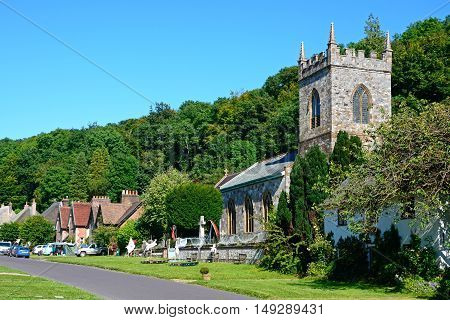 MILTON ABBAS, UNITED KINGDOM - JULY 19, 2016 - View along the pretty village street with the church in the foreground Milton Abbas Dorset England UK Western Europe, July 19, 2016.