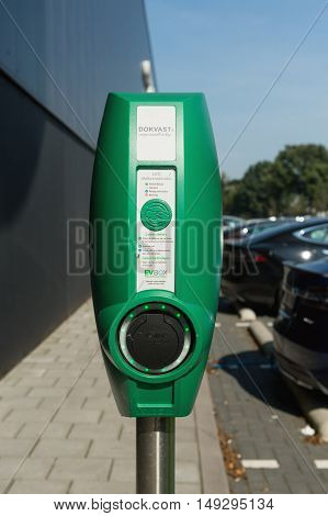 TILBURG, NETHERLANDS - SEPTEMBER 25, 2016: Electric vehicle charging station in  Tesla Supercharger Station of Tilburg, Netherlands.