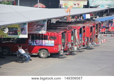 CHIANG MAI, THAILAND - FEBRUARY 28 2015: Red taxi Chiang Mai at Taxi to City Center. Photo at Chiangmai bus station, thailand.