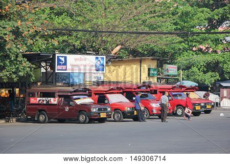 CHIANG MAI, THAILAND - FEBRUARY 28 2015: Red taxi Chiang Mai at Taxi to City Center. Photo at Chiangmai bus station, thailand.