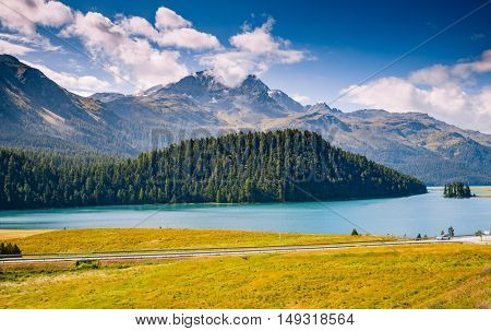Great view of the azure pond Champfer in alpine valley. Popular tourist attraction. Picturesque and gorgeous scene. Location Swiss alps, Silvaplana village, district of Maloja, Europe. Beauty world.