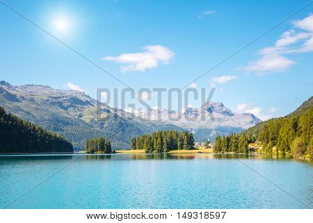 Great view of the azure pond Champfer in alpine valley. Popular tourist attraction. Picturesque and gorgeous scene. Location Swiss alps, Silvaplana village, district of Maloja, Europe. Beauty world.
