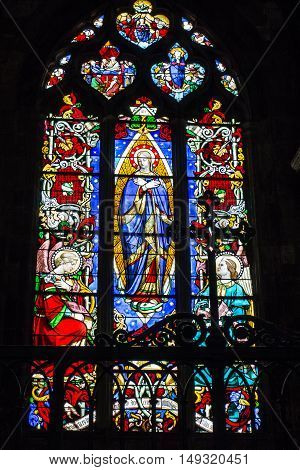 Poitiers France - September 12 2016: Very old church Notre Dame la Grande in Poitiers France ornate stained glass window in one of the windows of the church