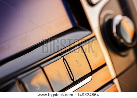 Gadgets interactive panel in the new car in the setting sun