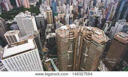 Top view aerial photo from flying drone of a business center in China with headquarter and office buildings with contemporary architecture. Exterior of a skyscrapers in metropolitan Hong Kong city