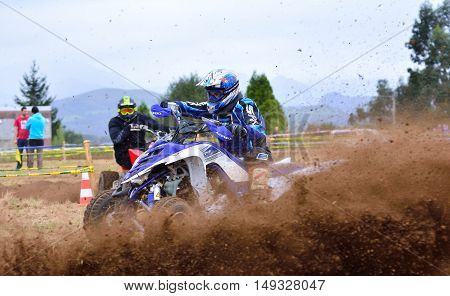 Unidentified Racer Rides A Quad Motorbike.