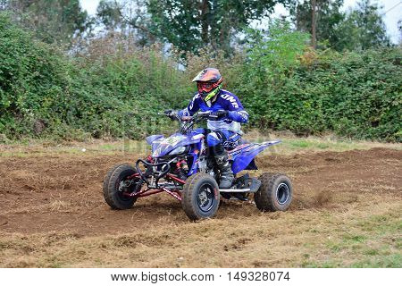 Unidentified Racer Rides A Quad Motorbike.