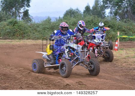 Unidentified Racer Rides A Quad Motorbike.