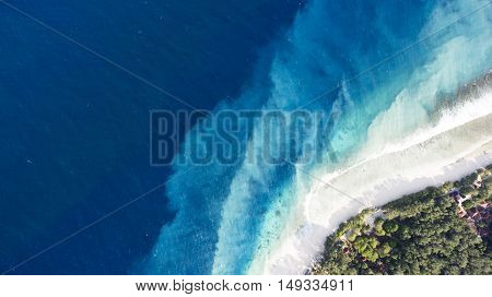 Top view aerial drone photo of one of the most beautiful beaches in the world incredibly beautiful blue water makes a fascinating picture while ocean current carries the white sand seabed. Background